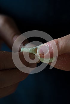 Hands preparing pasta