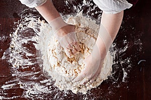 Hands preparing pizza dough