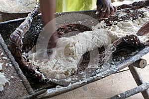 Hands preparing yucca bread