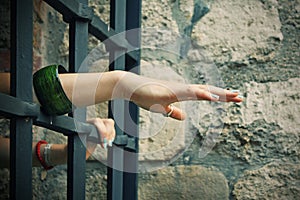 Hands of prisoner in cell