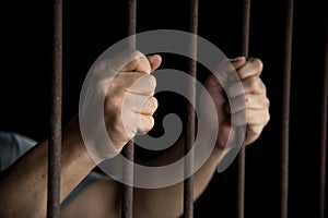 Hands of the prisoner in jail photo