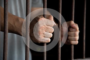 Hands of the prisoner in jail