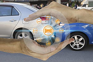 Hands are protecting with car claim icons over the Network connection on car crash background, car accident for car insuranc claim