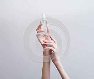 Hands in protective gloves with a syringe and antiseptics