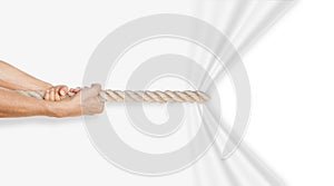 Hands pulling rope