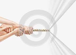 Hands pulling rope photo