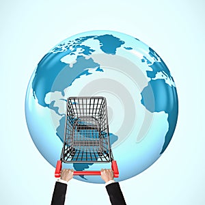 Hands pushing shopping cart on 3D globe with world map