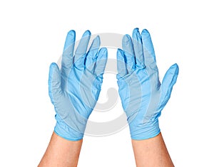 Hands putting on protective blue gloves.