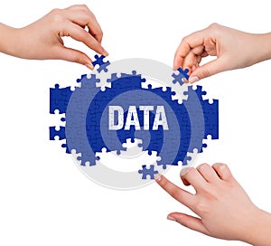Hands with puzzle making DATA word