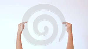 Hands raised, pointing to  an empty area to create a white background feature