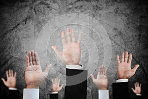 Hands raising upward on concrete background, abstract concept and ideas