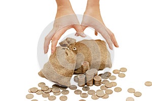 Hands reach for bags with coins