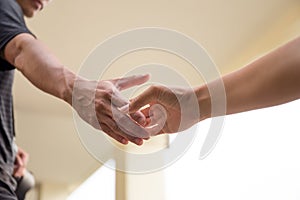 Hands reaching out to help together