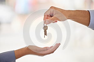 Hands, realtor and agent giving keys to customer after moving into new home. Property, real estate and handing over key