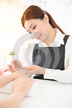 Hands receiving a hand cream lotion