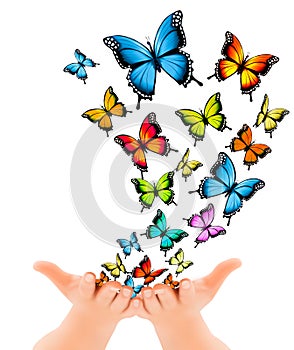 Hands releasing butterflies.