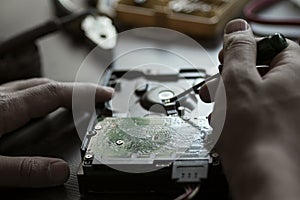 Hands repair hard drive