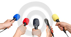 Hands of reporters with many microphones isolated on white