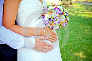 Hands with rings and bouquet