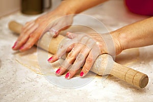 Hands with rolling pin