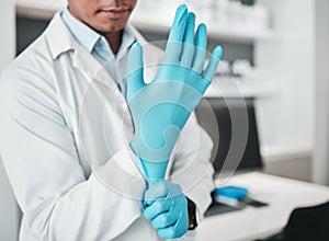 Hands, science and gloves for healthcare with a person in a laboratory for research or innovation closeup. Safety