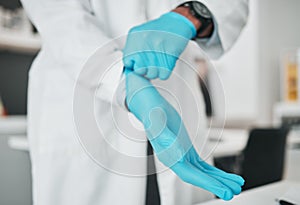 Hands, science and gloves for safety with a person in a laboratory for research or innovation closeup. Healthcare