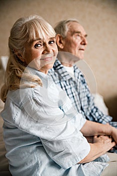 Hands of senior couple being held together