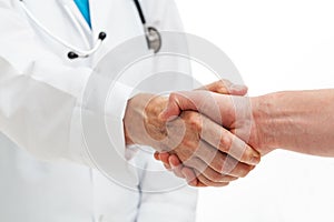 Hands shaking with doctor