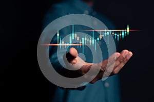 Hands show up target analyze sales data trading and showing a growing virtual screen of statistics, graph and chart. Stock market