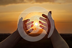 Hands shows a peaceful atom