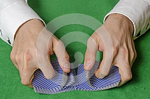 Hands shuffling cards casino