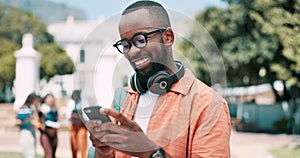 Hands, smartphone and black man typing outdoor, student on campus with communication and headphones. Chat, internet