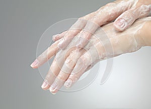 Hands with soap foam ad bubbles