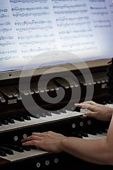 Hands of Someone playing Organ