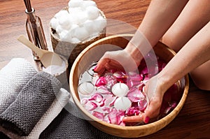 Hands spa, beautiful woman's hands in bowl of water