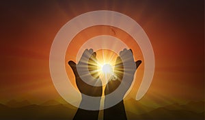 Hands with spark of hope, the light of faith, orange sunset background