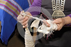 Hands spinning sheep's wool