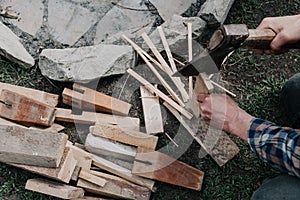 Hands with split wooden board