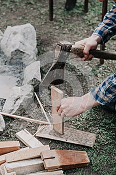 Hands with split wooden board