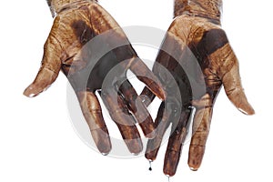 Hands stained with black petrol isolated on white