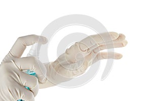 Hands in sterile rubber gloves with antiseptic spray isolated on white