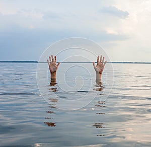 Hands sticking out of water