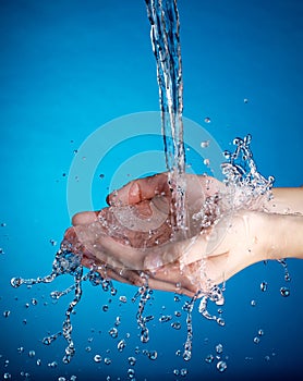 Hands and stream of water.