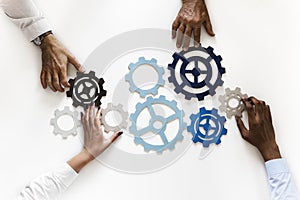 Hands with support gears on white background