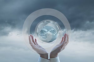 Hands support the infinity sign