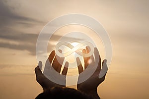 Hands support the sign of infinity