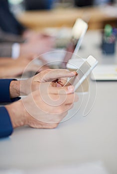 Hands, tablet or computer and business people in meeting researching, internet browsing or networking in office