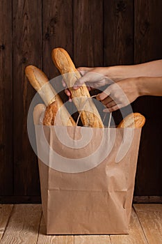 Hands Takes Breads Bought In Store From Paper Bag