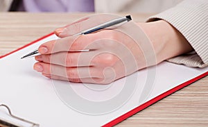 Hands taking notes in the pad