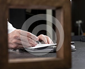 Hands taking notes, writing in note book. Businessman planning at office desk